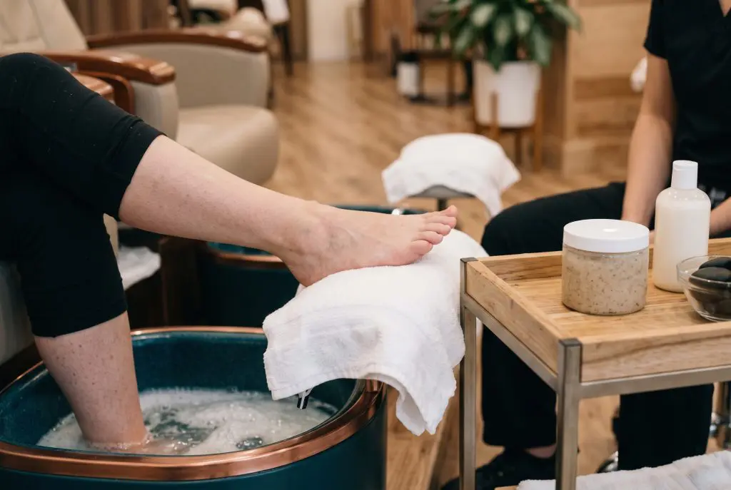 Client relaxing during a luxury spa pedicure treatment at a San Antonio nail salon